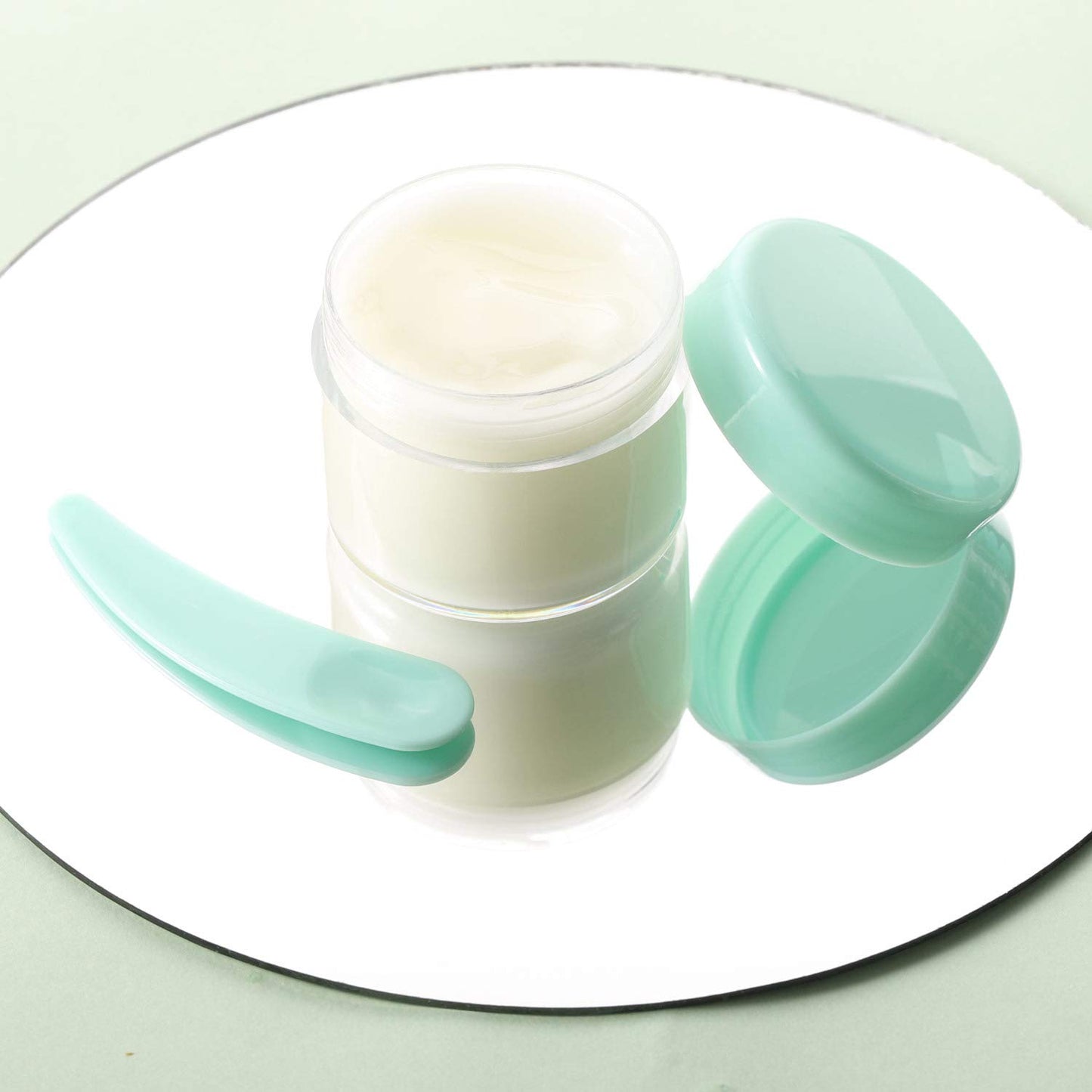 Refillable Cosmetic Sample Jars - 100 Pack 20g (0.7oz) Green Small Travel Containers with Lids + 10 Mini Makeup Spatulas - BPA Free